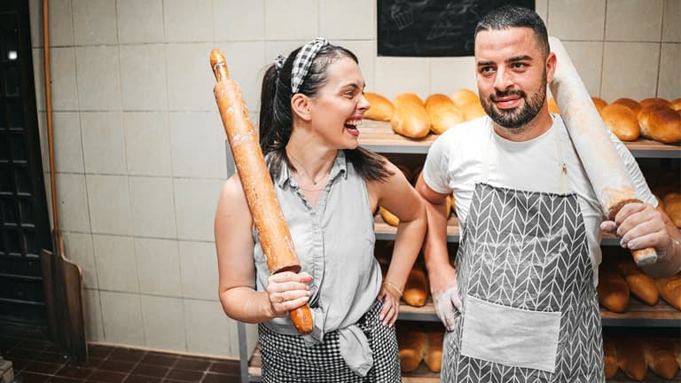Two small business owners in their bakery