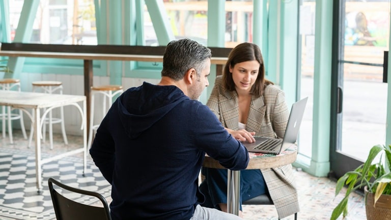 Business owners discussing cold email outreach